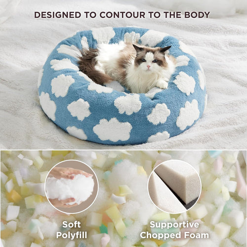 Cat lying on a blue and white cloud-patterned pet bed with text highlighting features.