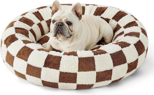 Dog sitting comfortably in a MIAYLUNE donut dog bed with a brown checkerboard pattern.